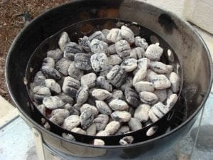 Two chimneys of hot coals spread inside the charcoal chamber