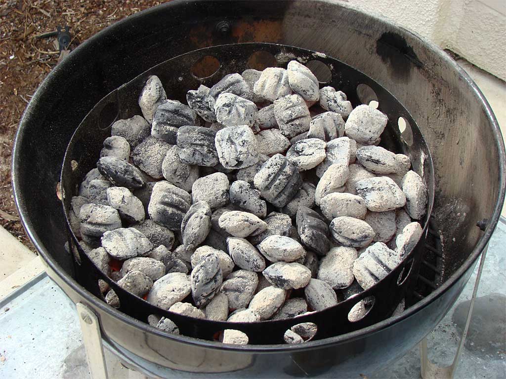 Two chimneys of hot coals spread inside the charcoal chamber