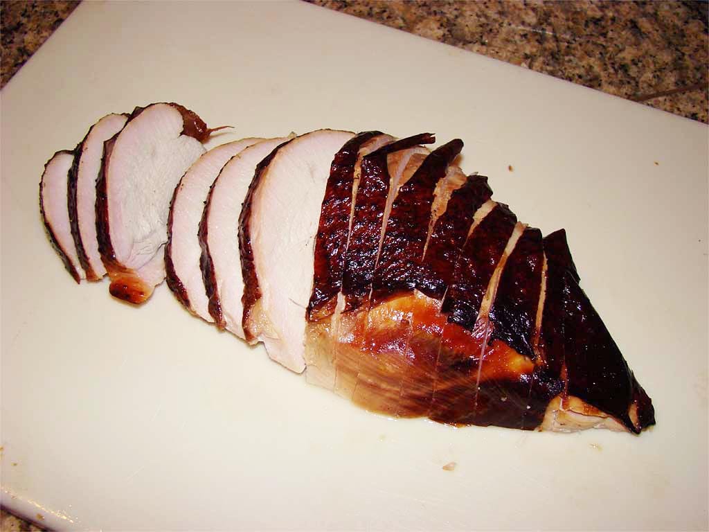 Sliced turkey breast on cutting board