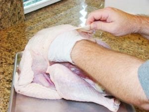 Rubbing salt on the breast meat