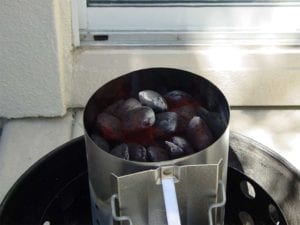 Flames licking at coals at top of chimney