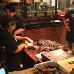 Meat cutting behind the counter