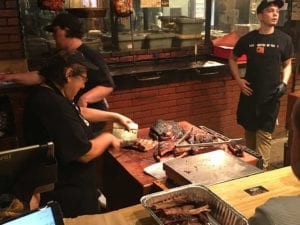 Meat cutting behind the counter