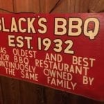 Sign touting Black's as one of the oldest joints in Texas