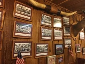 Old high school football team photos adorn the walls