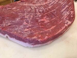 Rounding one end of the brisket flat