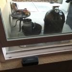 Smoke base unit next to smoker, WiFi gateway in window sill