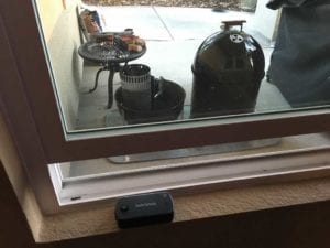 Smoke base unit next to smoker, WiFi gateway in window sill
