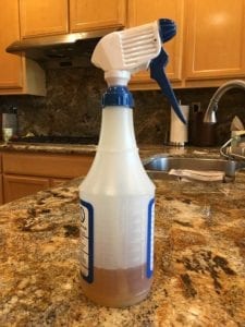 Spray bottle with apple cider vinegar for spritzing brisket