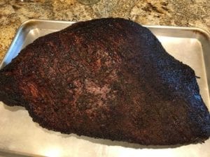 Brisket ready for wrapping in pink butcher paper