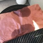 Whole brisket wrapped in pink butcher paper