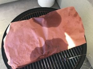 Whole brisket wrapped in pink butcher paper