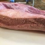 Discolored edge of brisket before trimming