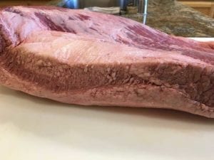 Discolored edge of brisket before trimming