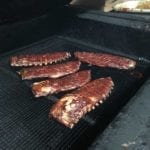 Slabs of spareribs in pit