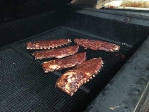 Slabs of spareribs in pit