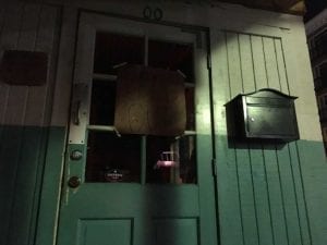 Streetlight casts shadow on Franklin Barbecue front door