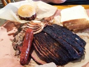 Our order at Franklin Barbecue. Clockwise from top left: chopped beef sandwich, turkey breast, pork ribs hiding under the turkey, fatty brisket, lean brisket, original sausage link, and pulled pork