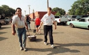 Roy Perez and Lehman Schmidt dragging hot coals to the new Kreuz Market, August 30, 1999