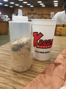 Salt, pepper, cayenne mix at the table