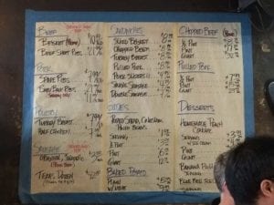 Menu written on white butcher paper