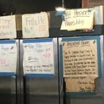 Lots of signs on white butcher paper
