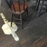 View of wooden floor with metal patch