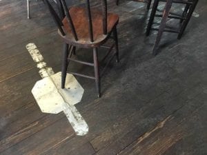 View of wooden floor with metal patch
