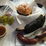 Our food order: brisket sandwich, beef short rib, sparerib, and sausage link