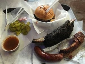 Our food order: brisket sandwich, beef short rib, sparerib, and sausage link