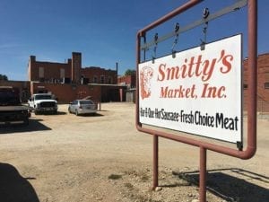 Smitty's Market sign and parking log