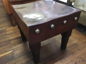 Old butcher block table in fresh meat market