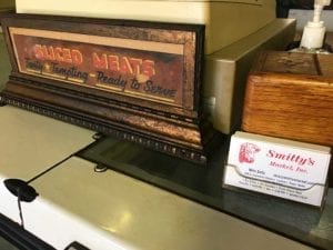 Sign and business cards in fresh meat market