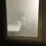 Steamy view into sausage prep room