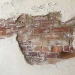 Plaster and exposed brick in overflow dining room