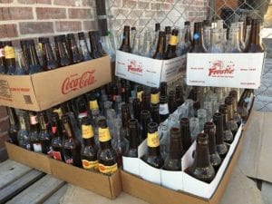 Stack of empty bottles behind Smitty's Market