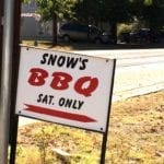 Street sign pointing the way to Snow's BBQ