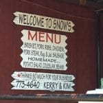 Menu sign on the porch at Snow's BBQ