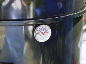 Thermometer mounted in cooking section
