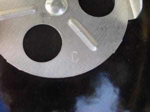 Charcoal bowl damper indicating "C" date stamp
