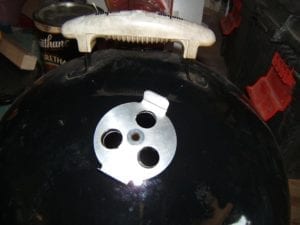 Close-up of new damper fastened with BBQ Guru eyelet