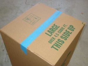 Taping the cardboard box