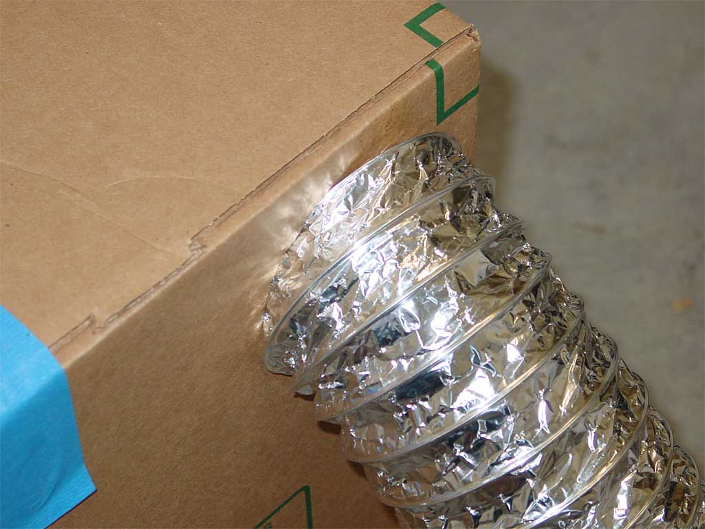Foil duct screwed into cardboard box