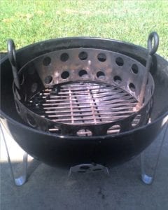 Eye bolts fastened to charcoal grate