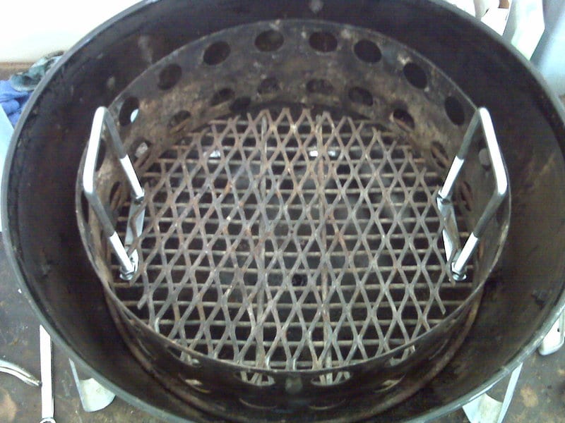 U-shaped bolts fastened to charcoal grate