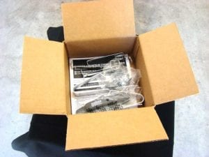 Legs, grate support straps, lid handle, silicone grommet, hardware pack, and owner's manual