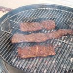 Skirt steak grilled over lump charcoal on 22" WSM