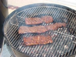 Skirt steak grilled over lump charcoal on 22" WSM