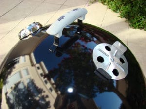 Overhead view of lid handle, damper, and thermometer