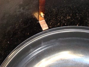 Close-up of water pan and grill strap